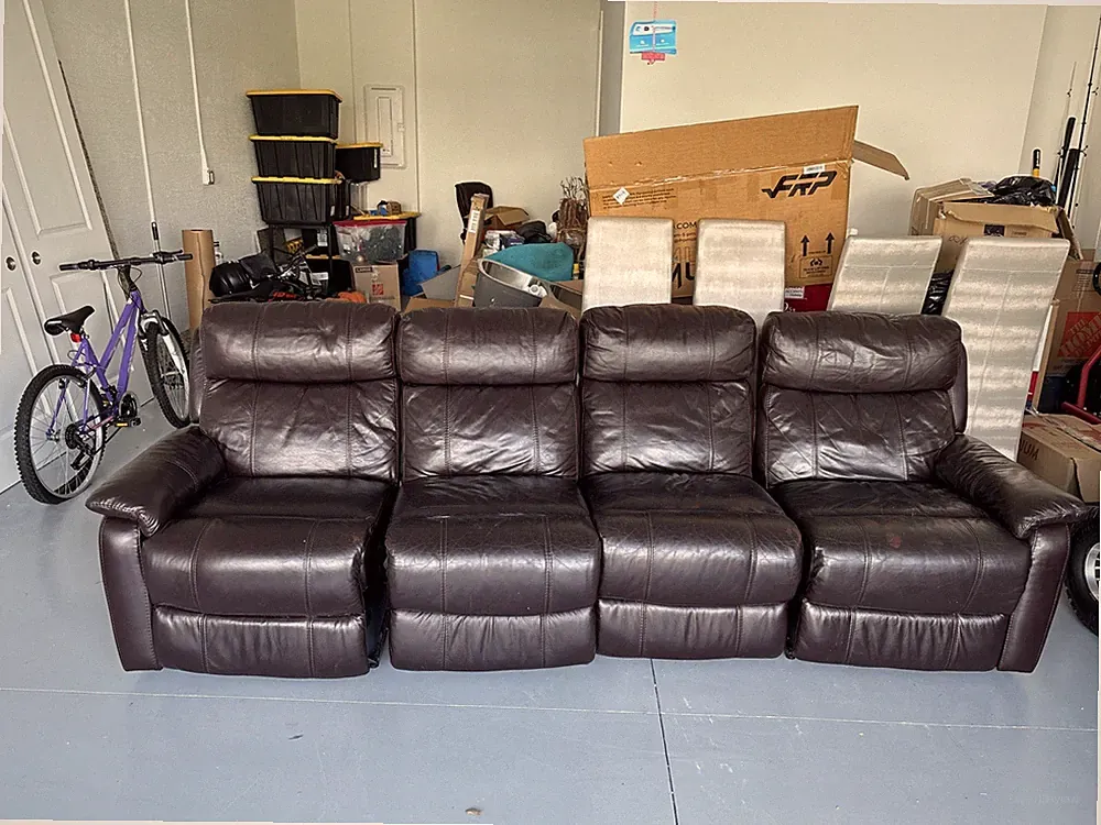 Leather Couch With Two Electric Reclining Sheet Seats And Cell Phone Charger..